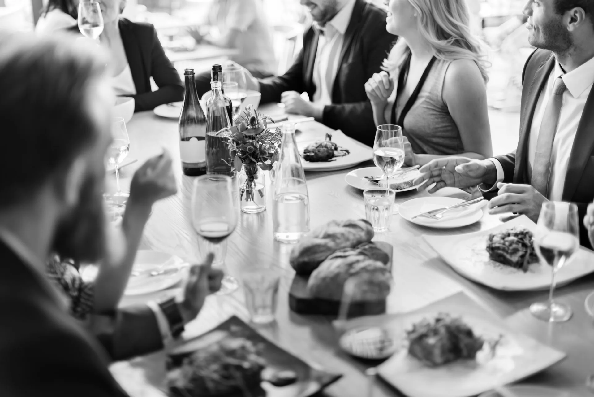 People sharing a meal together at a dinner table